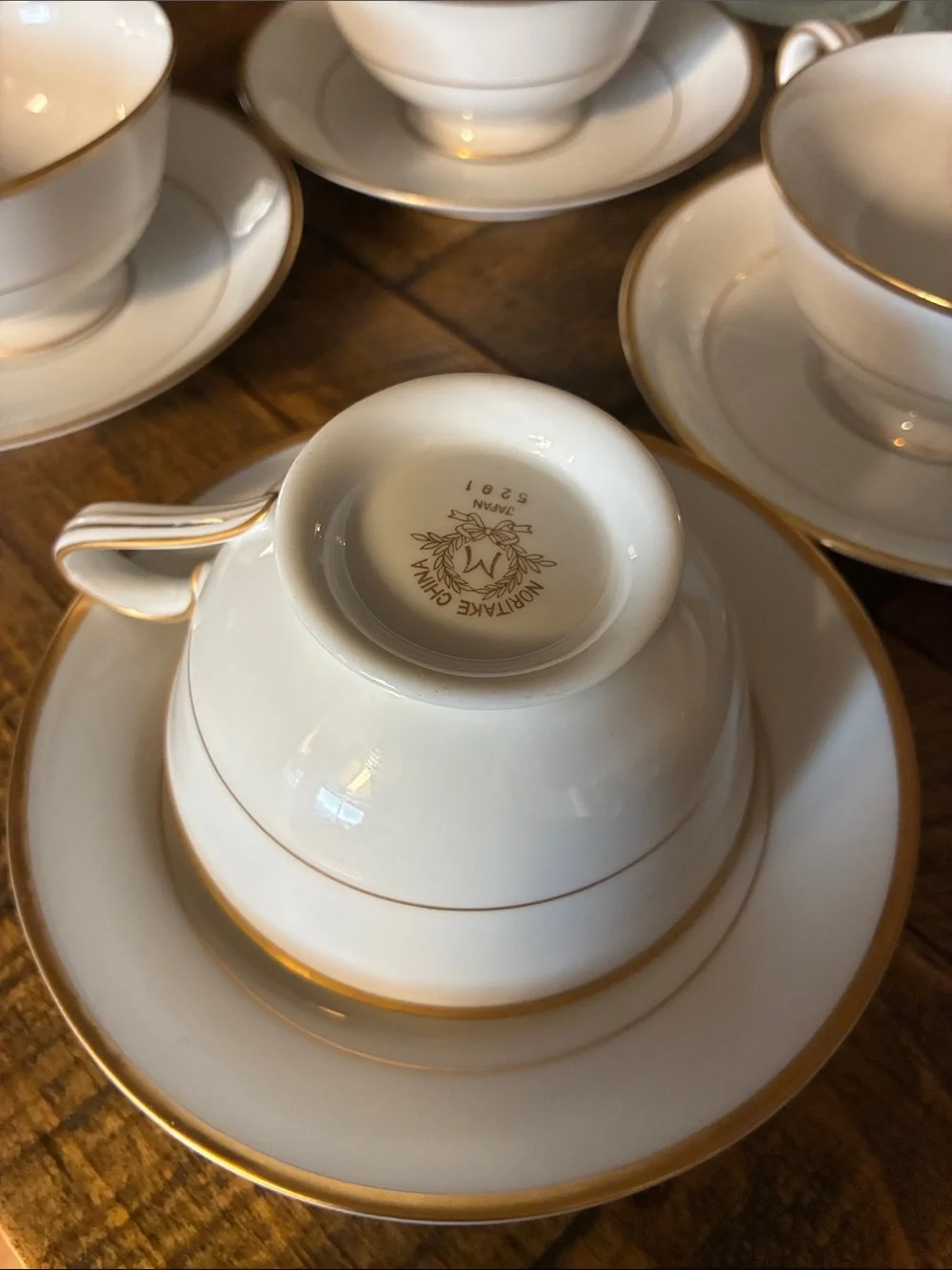 Noritake White Porcelain Teacup and Saucer Set with Gold Trim